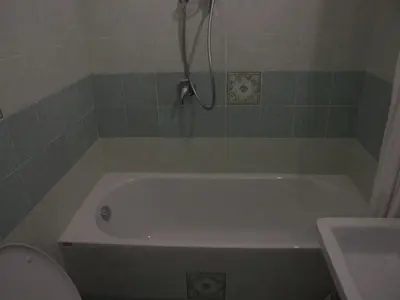 a white bath tub in a bathroom with a toilet at Hotel Texas in Rome