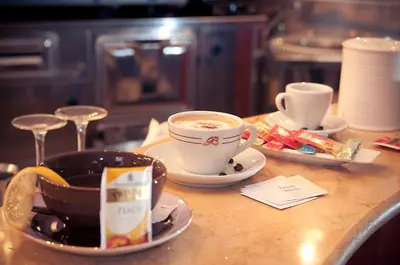 a table with two cups of coffee and saucers at Hotel Priscilla in Rome