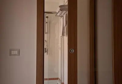 a glass door to a shower in a bathroom at Hotel Concordia in Rome