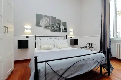a bedroom with a large bed in a room at 4BNB - Otranto Vatican Apartment in Rome
