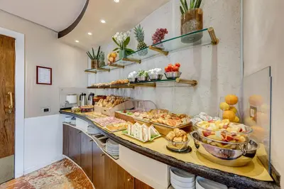 a buffet line with many different types of food at Best Western Hotel Piccadilly in Rome