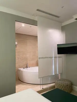a bathroom with a bath tub in a room at Hotel Accademia in Rome