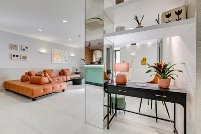 a living room with a couch and a table at Romoli Hotel in Rome