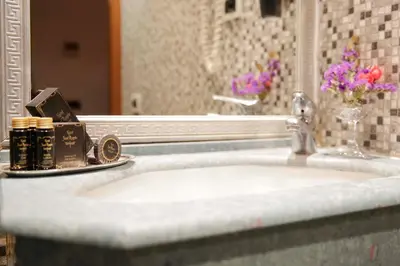 a bathroom counter with a sink and a mirror at Hotel Sant'Angelo in Rome