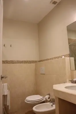 a bathroom with a toilet and a sink at My Monti Place in Rome