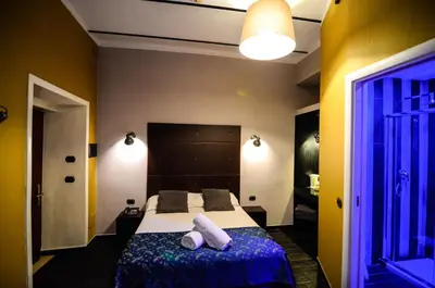 a bedroom with a bed with two white towels on it at Hotel Felice in Rome