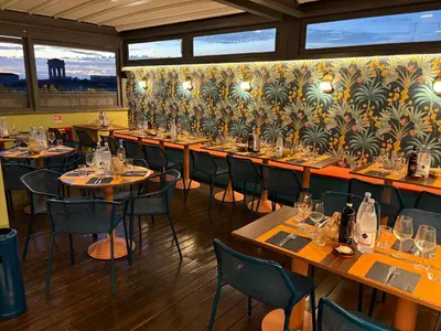 a dining room with tables and chairs in a restaurant at Hotel Montecarlo in Rome