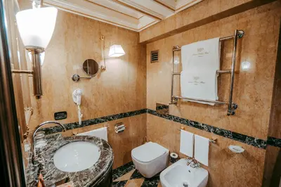 a bathroom with a sink and a toilet at River Palace Hotel in Rome