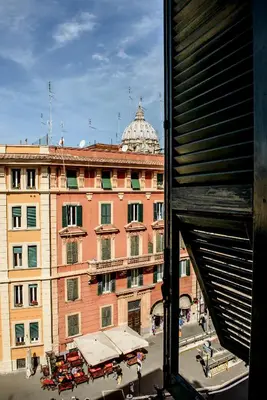 a view from a window of a large building at Hotel Emmaus in Rome