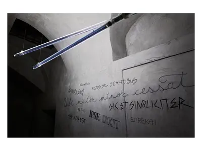 a writing on a wall with a pen on it at Casa de' Coronari in Rome