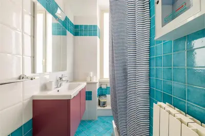 a bathroom with a sink and a mirror at House Montebello in Rome