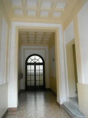 an empty hallway with a door in a building at Domi Aloisii in Rome
