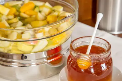 a jar of honey next to a pot of fruit at Best Western Hotel Astrid in Rome