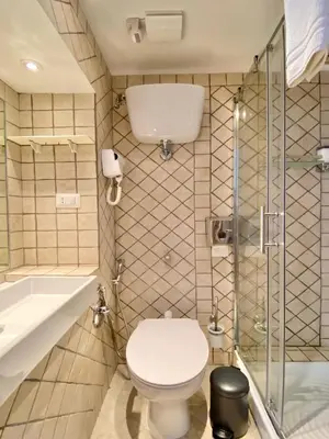 a bathroom with a toilet and a shower at Roome B&B in Rome