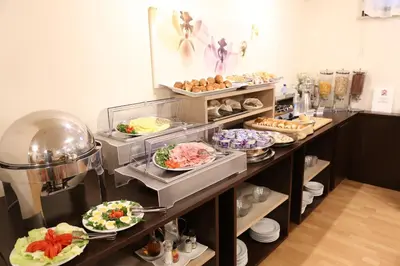 a buffet line with plates of food on display at Hotel Sisto V in Rome