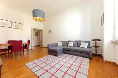 a living room with a couch and a table at 4BNB - Chinotto Spacious Apartment in Rome