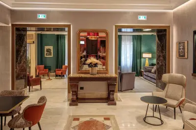 a hotel lobby with a mirror and a room at Hotel Diana Roof Garden in Rome