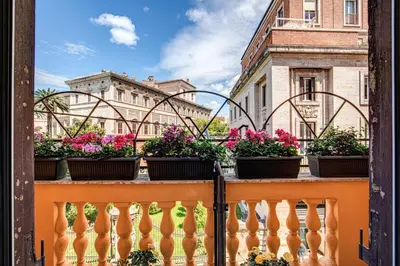 a balcony with potted plants on a ledge at Al Manthia Hotel - Gruppo Trevi Hotels in Rome