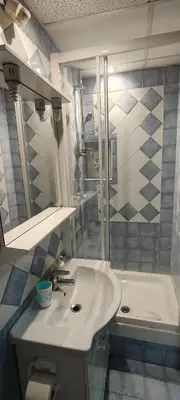 a bathroom with a white sink and a tub at Er Centurione in Rome
