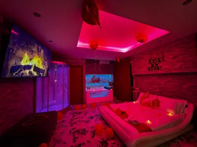 a room with a bed with a pink lighting at Er Centurione in Rome