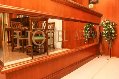 a store window with a table and chairs in it at Albergo Athena in Rome