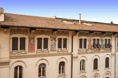 a building with mosaics on the facade at Roma Boutique Hotel in Rome