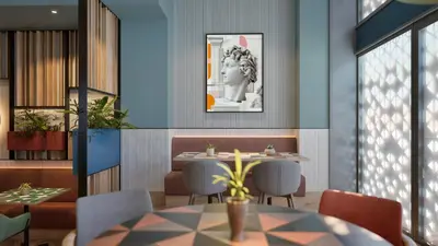 a dining room with a table and chairs at Hilton Garden Inn Rome Colosseum in Rome
