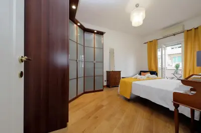 a hotel room with a bed and a window at 4BNB - Cipro Vatican Apartment in Rome