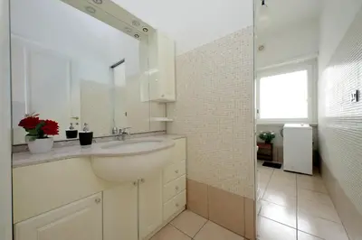 a bathroom with a sink and a glass shower at 4BNB - Cipro Vatican Apartment in Rome