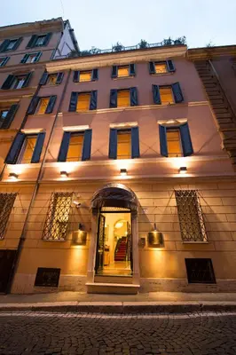 a large building with yellow and blue windows at Hotel Gregoriana in Rome