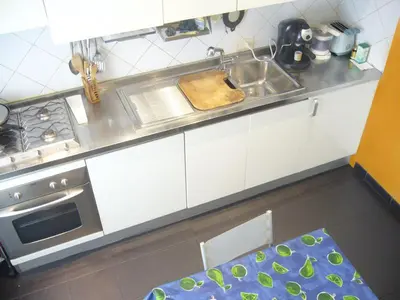 a kitchen with a sink and a counter top at B&B&Courtesy in Rome