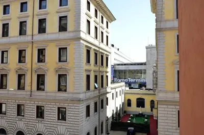a view of a tall building from a window at Hotel Tex in Rome