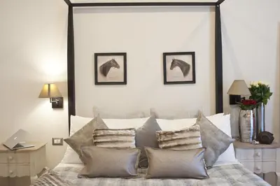 a bedroom with a bed with pillows on it at Town House 62 in Rome