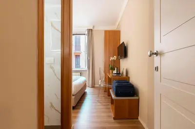 a hotel room with a bed and a door at Hotel Magic in Rome