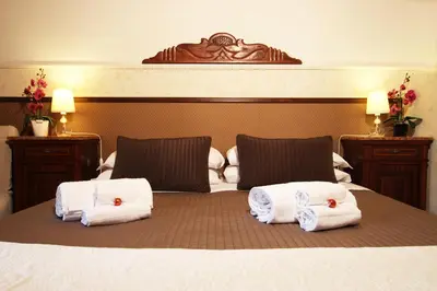 a bedroom with a bed with two white towels on it at Campanella3 in Rome