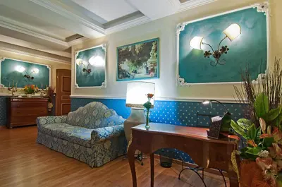 a living room with a couch and a table at Residenza Antica Roma in Rome