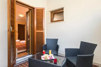a room with chairs and a table with a cake on it at Hotel Villa Rosa in Rome