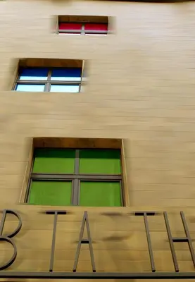 a building with a sign in front of a window at Hotel Abitart in Rome