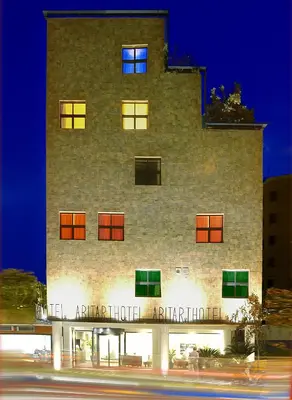 a building with a sign on the front of it at Hotel Abitart in Rome
