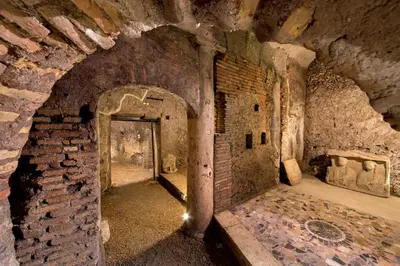an old room with a brick wall and a doorway at The Inn at the Roman Forum Luxury Collection - The Inn At The Roman Forum in Rome