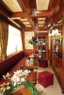 a living room with a couch and a table at Hotel Champagne Palace in Rome