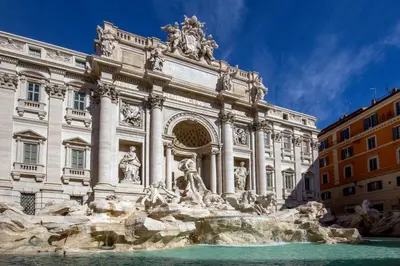 a building with a fountain in front of it at Albergo Ottocento in Rome
