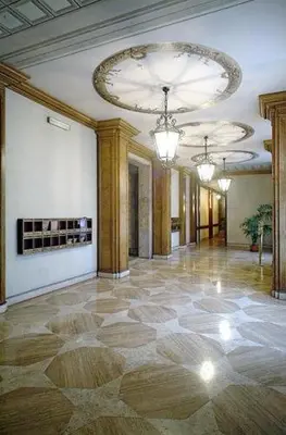 a large room with a large lobby with a chandelier at Domus Livia in Rome