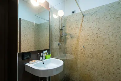 a bathroom with a sink and a shower at Residence Europa in Rome