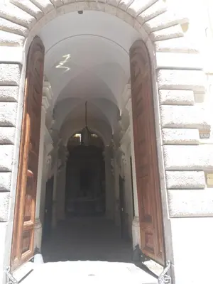 an archway in a building with wooden doors at Residence Europa in Rome