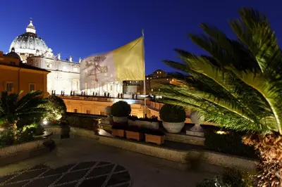 a large building with a flag in front of it at Residenza Paolo VI in Rome