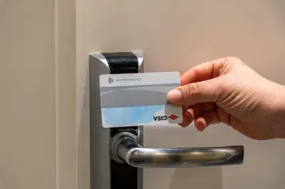 a person holding a credit card in front of a door at Guesthouse Sant'Angelo in Rome