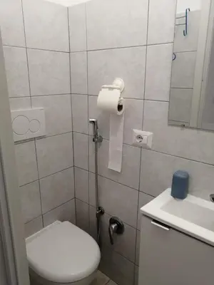 a small bathroom with a toilet and a sink at Roma Prince Inn accommodation in Rome