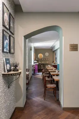 a dining room with wooden tables and chairs at Boutique Hotel Galatea in Rome