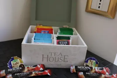 a tea house box sitting on a table with snacks at B&B Gaudium Colosseo in Rome